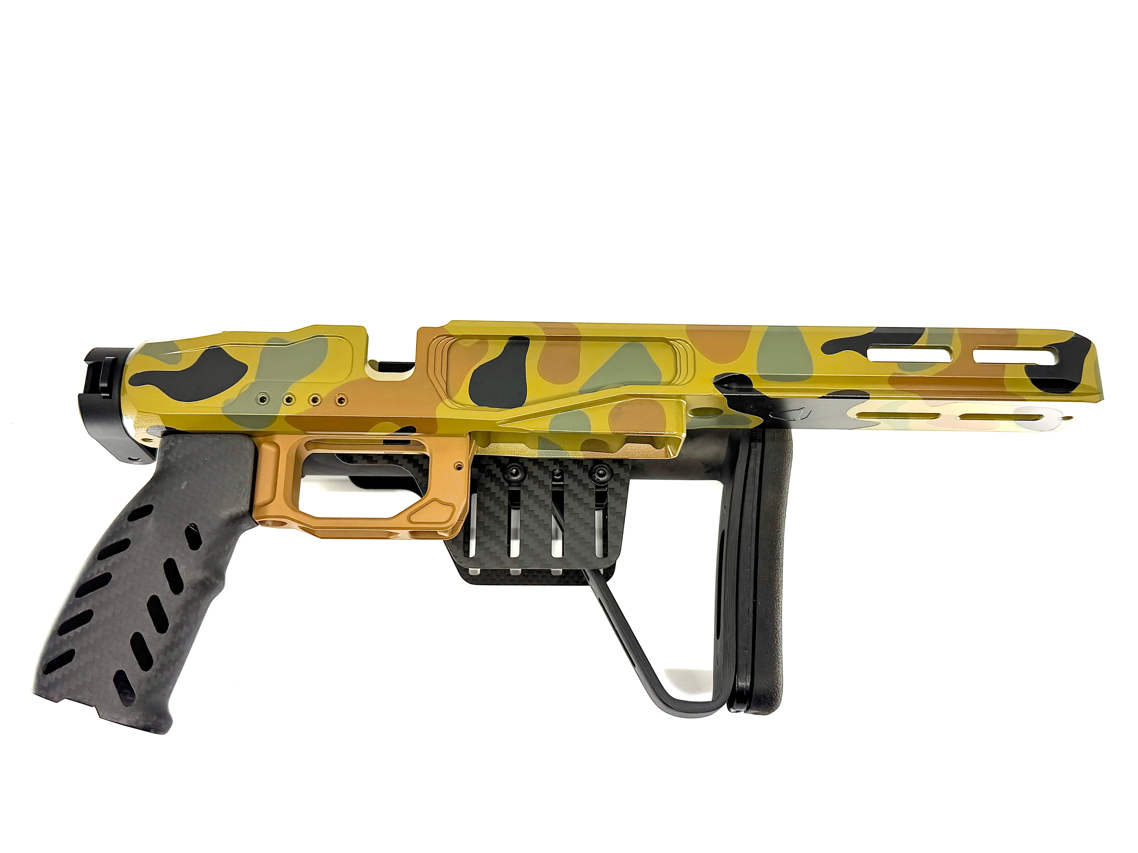 Custom duck camo Cerakote precision rifle chassis — gold, olive, and black pattern with carbon fiber accents and folding brace by Northwoods Firearms