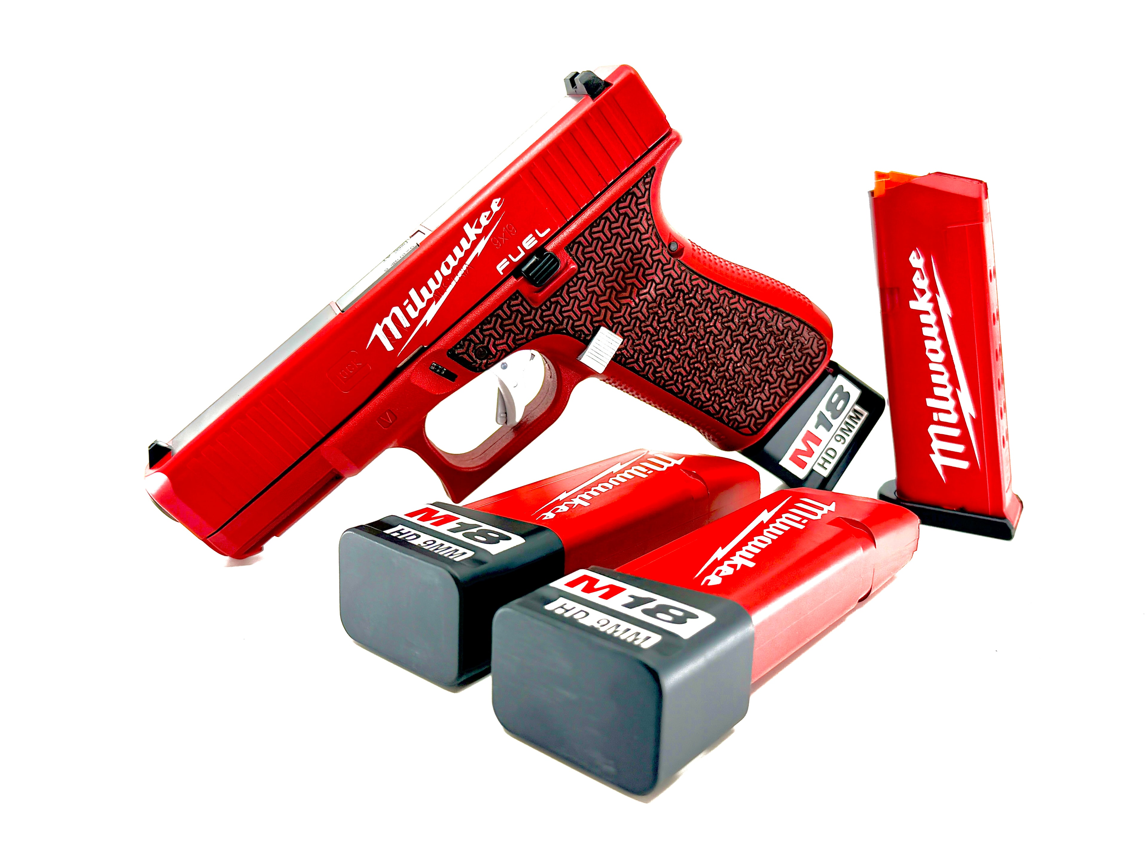 Milwaukee Tool themed Cerakote Glock — red and black finish with Milwaukee Fuel branding and matching magazine base plates by Northwoods Firearms