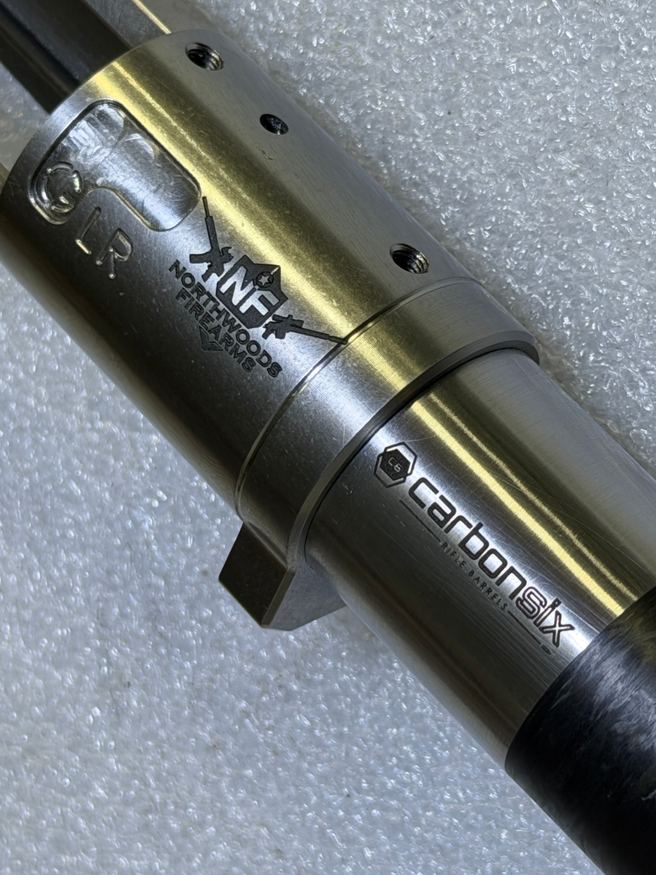 Northwoods Firearms logo laser-engraved on a Carbon Six rifle barrel with GLR action by Northwoods Firearms, Crandon, WI